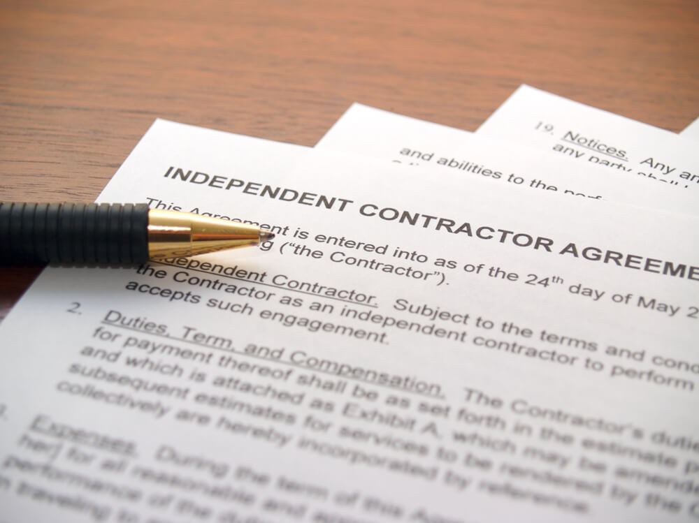 pen on an independent contractor agreement